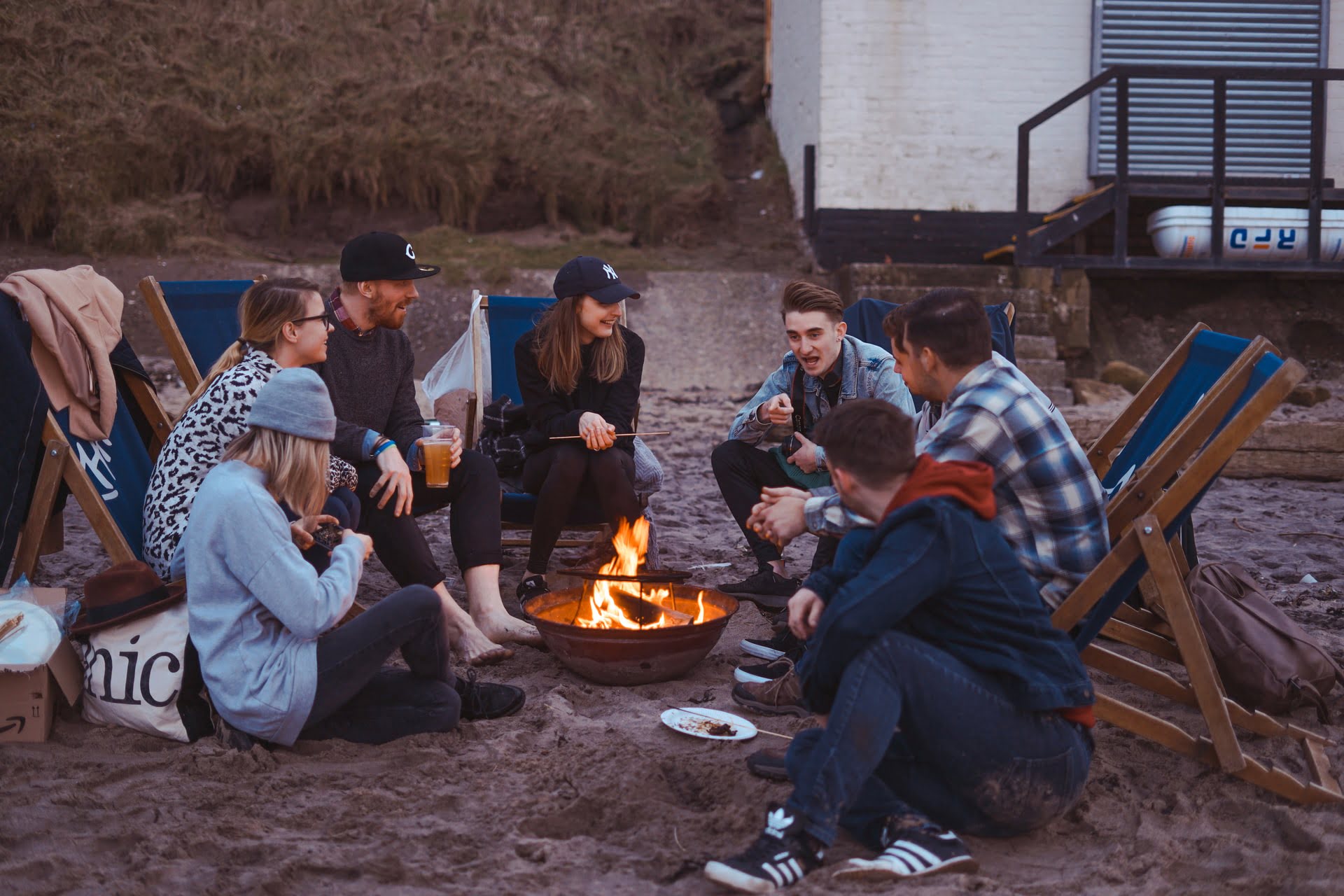 friends camping around a fire